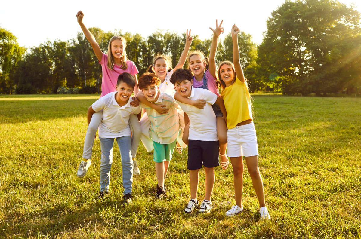 Happy,Children,Friends,Standing,Together,Outdoors,,Having,Fun,And,Smiling